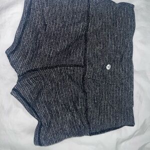 Speckled-like texture blackish/greyish
& white-ish. Lululemon “booty shorts”.